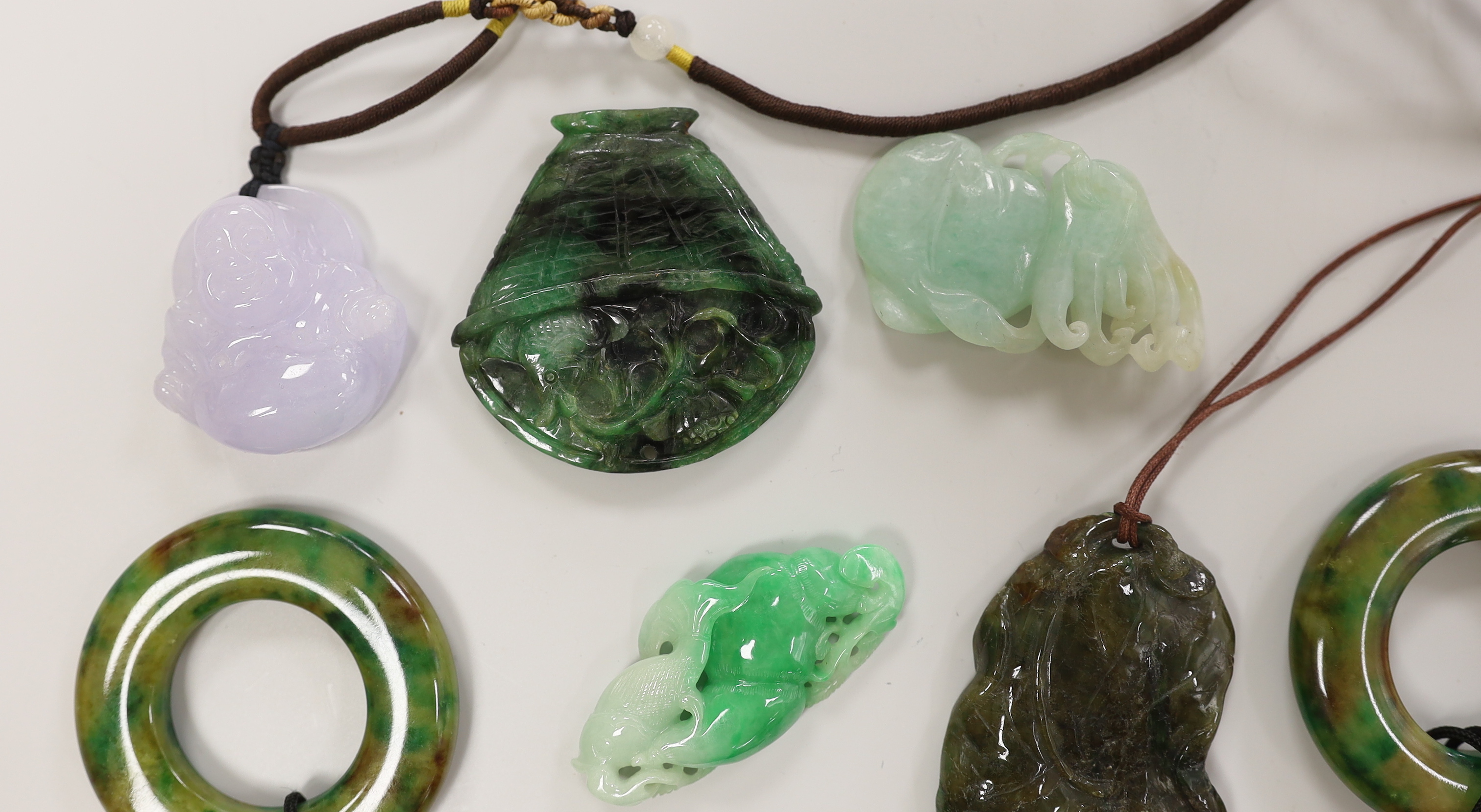 Eight assorted jade and hardstone carvings and pendants, largest 7cm long